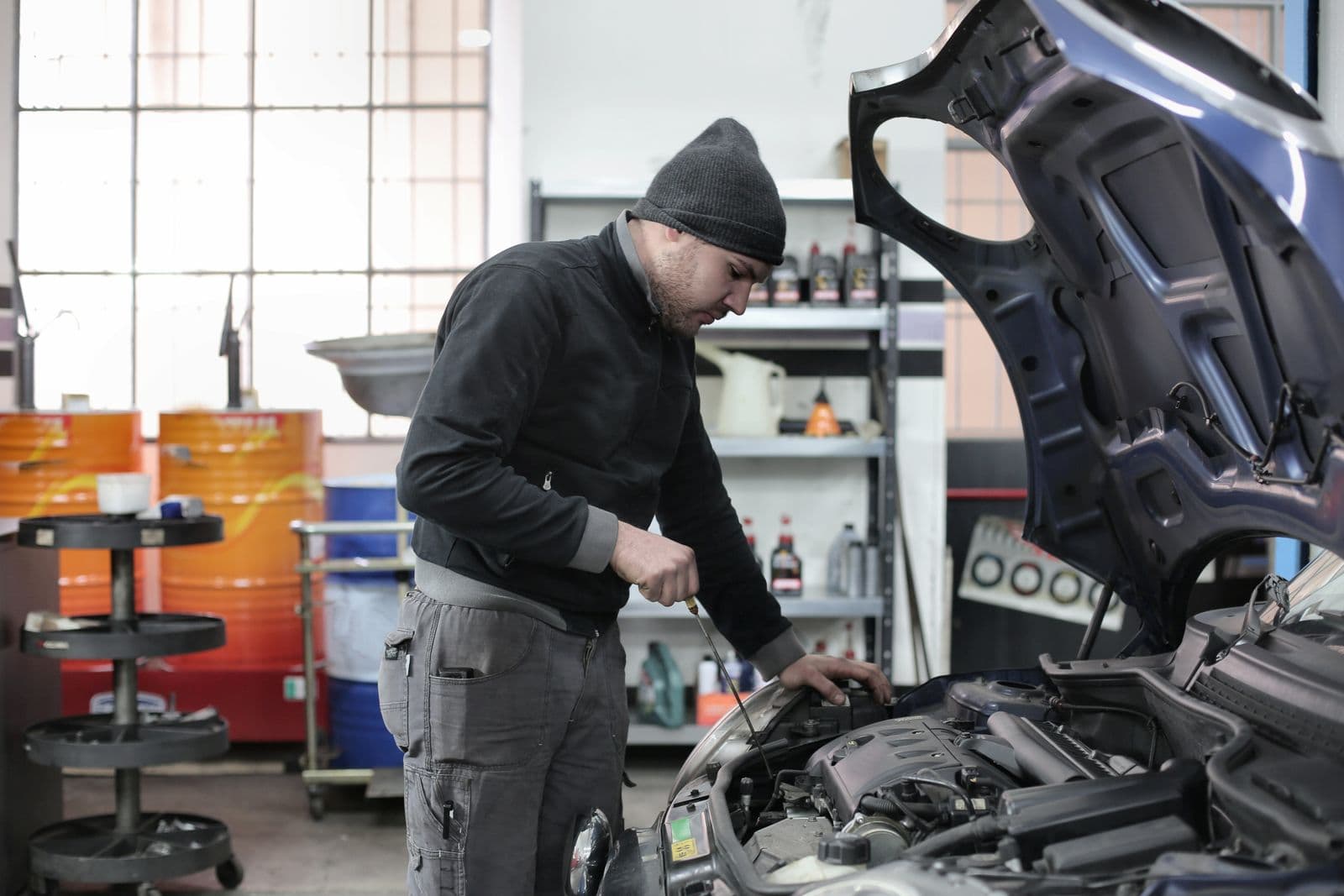 Technician performing engine maintenance