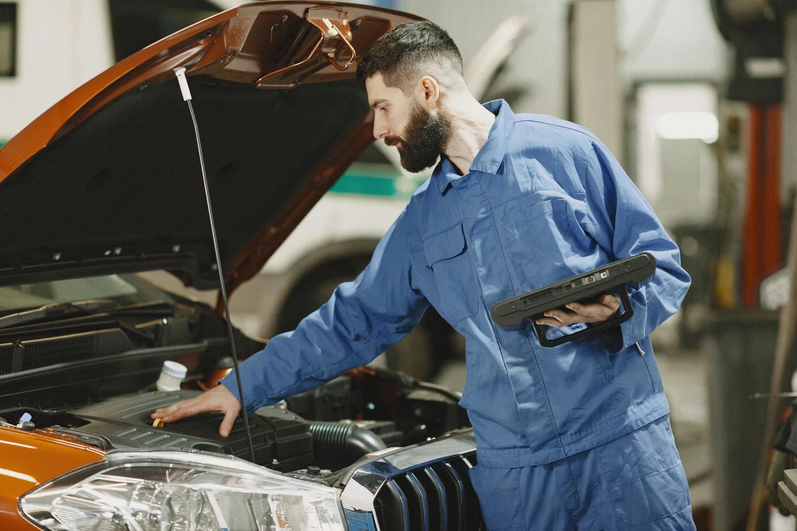 Mechanic servicing a car engine